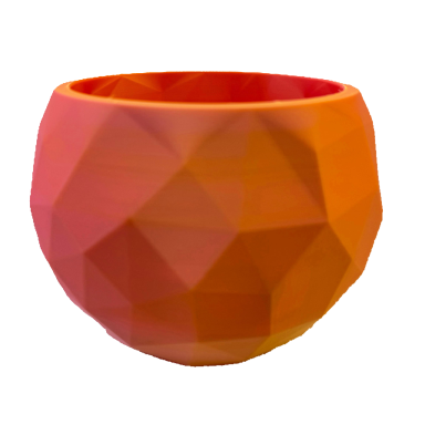 Geometrische, facettierte Schale in warmen Orange- und Rottönen.